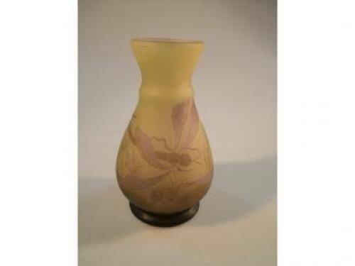 A small baluster vase decorated with a dragonfly and lilies