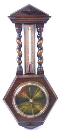 An oak cased barometer, with barley twist supports and hexagonal lower case, the brass dial engraved Rowley Nottingham, 51cm high.