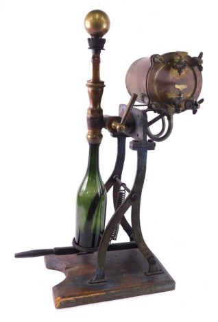 A late 19th/early 20thC brass wine bottle corking machine, incomplete, 77cm high. (AF)