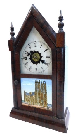 A late 19thC American mantel clock by Jerome and Co, the arched rosewood case with turned finials, the door inset with a printed verre eglomise panel of Westminster Abbey, 40cm high.