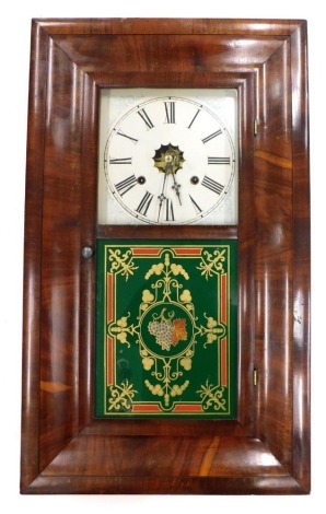 A late 19thC American wall clock by The Waterbury Clock Company, in ogee shaped mahogany case, with stencilled and painted dial, enclosed by a glass door, with red gilt and green verre eglomise panel of grapes, scrolls, etc., 65cm high.