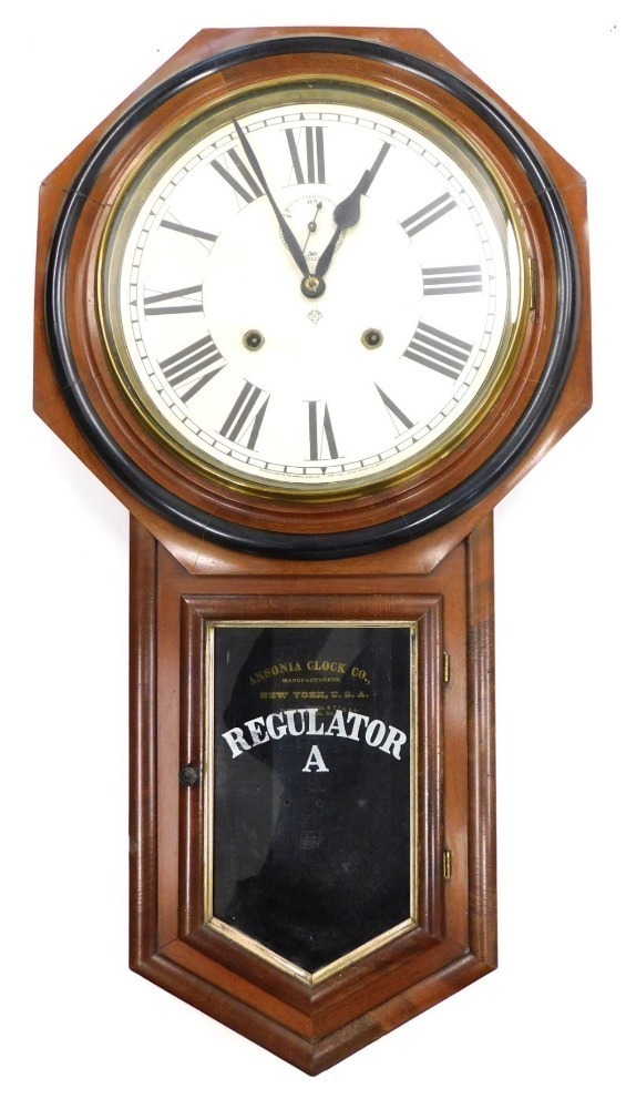 An American Ansonia Clock Company drop dial clock, in a walnut