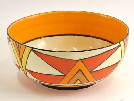 A 1930s Clarice Cliff pottery Bizarre pattern bowl, decorated with triangles predominantly in red, orange, brown and yellow, on circular foot, printed marks beneath, 19cm diameter.