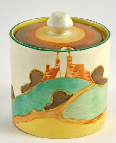 A Clarice Cliff Fatasque Orange Secrets pattern lidded preserve jar, of cylindrical form, with circular decorated lid, the main body polychrome decorated with printed marks beneath, 10cm high.