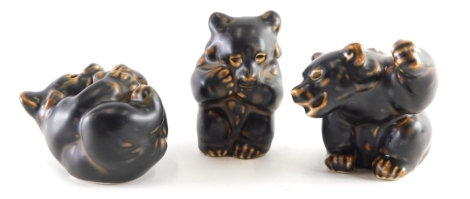 Three Copenhagen porcelain bear figures, in black and brown, wave marks beneath, 6cm high etc. (3)