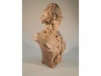 After Alfred J Foretay (1861-1944). A plaster bust of a young woman