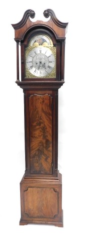 John Ivison, Carlisle. A George III mahogany longcase clock, the brass dial with moon phase subsidiary date aperture and engraved with scrolls, with an eight day movement, in a figured mahogany case on short bracket feet, 225cm high.