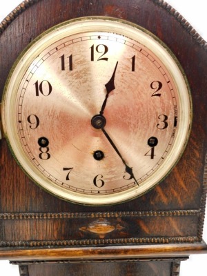 A 1920s oak grandmother clock, the silvered dial with Arabic numbers, 129cm high. - 2