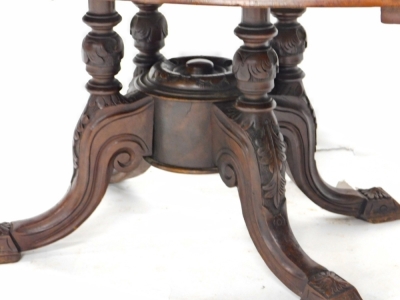 A walnut and marquetry coffee table, the oval top with a moulded edge on four turned columns and carved splayed legs, formed from a Victorian loo table, 100cm wide. - 3