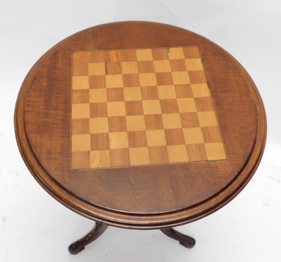 A Victorian walnut chess table, the circular inlaid top with a moulded edge, on a turned column and carved tripod base. - 2