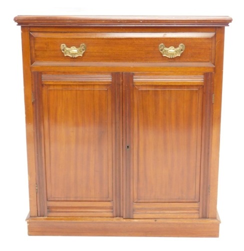 An Edwardian mahogany side cabinet, the top with a moulded edge above a frieze drawer and two panelled doors, on a plinth, 96cm high, 87cm wide.