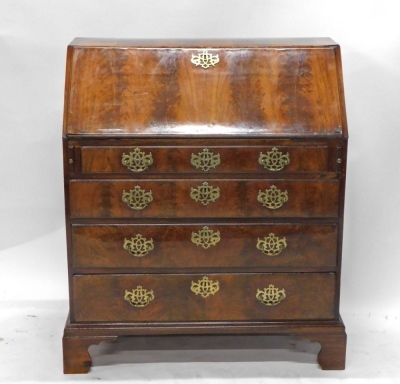 A George II figured mahogany bureau, the fall enclosing a fitted interior above four graduated drawers, with brass drop handles on bracket feet, 95cm wide. - 2