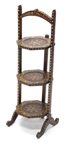 An Indian hardwood and bone three tier cake stand, with geometric design, flower heads, lozenges, etc., 80cm high.