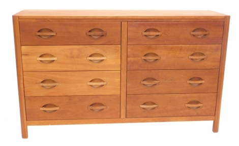 A Chris Sharp of Lincoln cherry chest of drawers, with a plain top, above two banks of four drawers, each with recessed and raised handles, on end supports, maker's leaf mark to support, 90cm high, 150cm wide, 45cm deep.