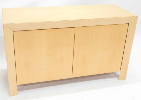 A Danish Skovby maple side cabinet, model number SM82MB, with two doors on plain and end supports, 73cm high, 124cm wide, 48cm deep.