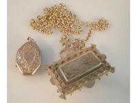 A rectangular Victorian memorial brooch with hair insert with pendant loop and chain