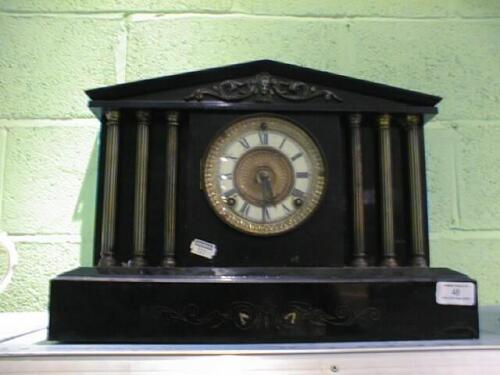 A Victorian polished slate Mantel Clock of architectural form