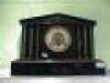 A Victorian polished slate Mantel Clock of architectural form