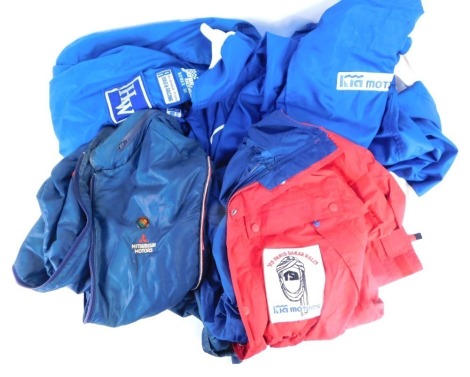 A group of rally clothing, comprising J Brand Racewear Nomex 3 blue overcoat and trouser set, a blue Mitsubishi Motors coat, and a red raincoat. (4)