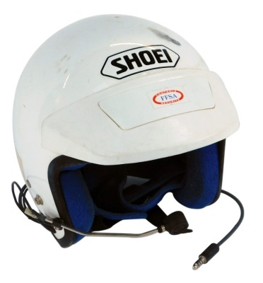 A Shoei Rally helmet, with speaker, in white.