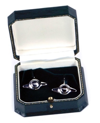 A pair of silver Aston Martin cuff links, each bearing the Austin Martin badge and logo engraving, 16.1g, in fitted box.