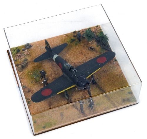 A 1:32 scale cased diorama model of a Mitsubishi Zero AGM, Pacific War, 14cm high, 36cm wide, 36cm deep.