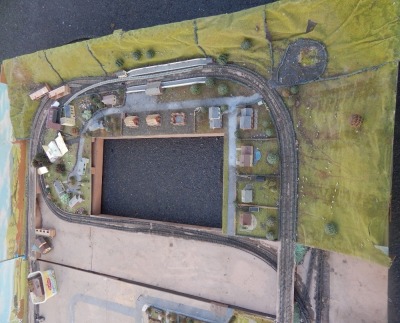 A N gauge substantial model railway layout, with buildings, trees, station platforms, etc., comprising of three sections. Measurements to follow. - 2