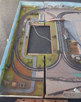 A N gauge substantial model railway layout, with buildings, trees, station platforms, etc., comprising of three sections. Measurements to follow. - 4