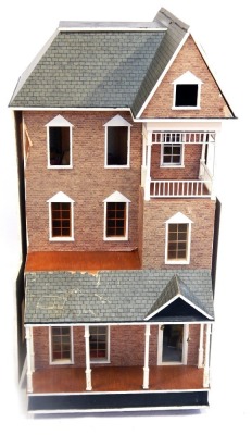 A three storey Tudor town house, with applied brick and slate finish, with a wallpapered interior, with some furniture and accessories, 114cm high, 74cm wide, 59cm deep.