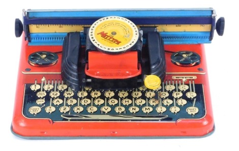 A Mettype Junior tin plate typewriter, no. 4315, boxed.