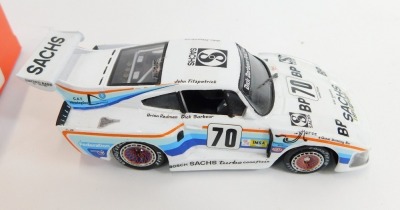 A Quartzo diecast model of a BMW M1 "BMW France", Le Mans 1980, 3039, scale 1:43, boxed, together with a Solido diecast Porsche 935 turbo and a Quartzo Kremer K3. (3) - 4