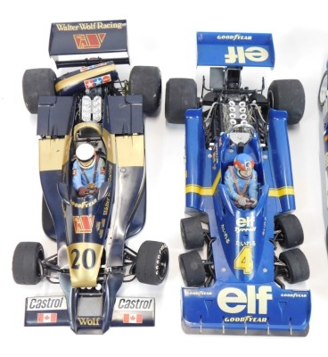 Four Tamiya large scale models of Formula 1 racing cars, and a further model of a Denny Hulme driven McLaren racing car. (5) - 2