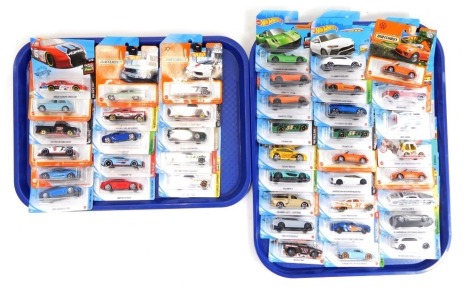 Hot Wheels and Matchbox diecast vehicles, in blister packs. (2 trays)