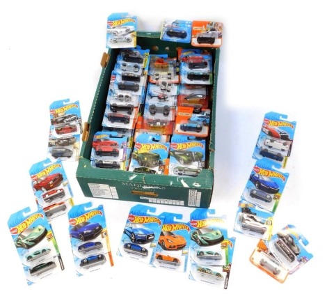 Hot Wheels and Matchbox diecast vehicles, in blister packs. (1 box)