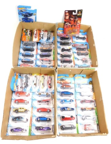 Hot Wheels diecast vehicles, a helicopter, The Incredibles Undermine Tunneler, all in blister packs. (4 boxes)