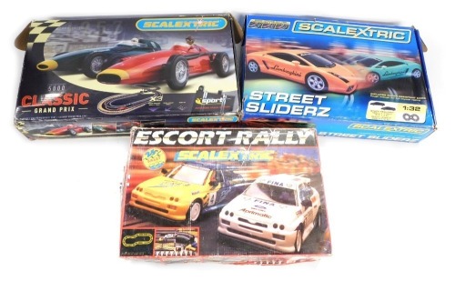 Three Scalextric boxed sets, comprising Escort Rally, Street Sliderz, and 5000 Classic Grand Prix. (3)
