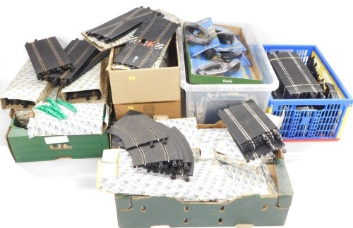 Scalextric track straights and curves, some boxed, together with controllers in blister packs. (5 boxes)
