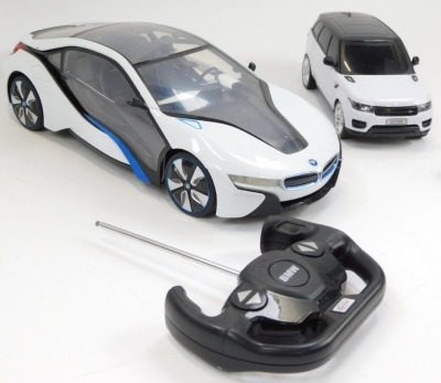 A Rastar remote controlled BMW I8, scale 1:14, together with a Gianfengyuan Toys Company Limited remote control model of a 2014 Range Rover Sport, both with controllers. - 2