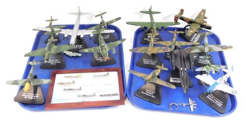 Diecast models of World War II fighter and bomber planes, a Lockheed SR 71 Blackbird, all on plastic mounted stands, together with Atlas Editions, badges of various aircraft. (2 trays)