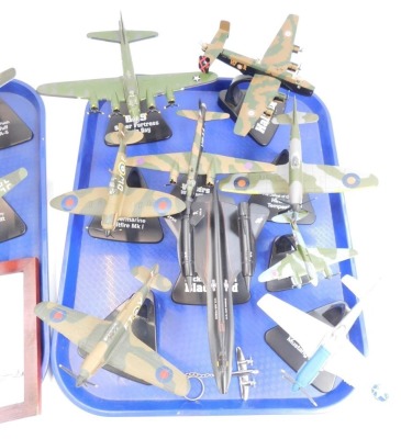 Diecast models of World War II fighter and bomber planes, a Lockheed SR 71 Blackbird, all on plastic mounted stands, together with Atlas Editions, badges of various aircraft. (2 trays) - 3