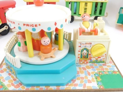 Fisher Price toys, comprising Fisher Price Mini Bus, Fisher Price Play Family Camper, Fisher Price Circus Train, and a Fisher Price Merry Go Round. (4) - 3