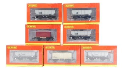 Hornby OO gauge rolling stock, comprising R6691 BR 21 ton hopper wagon pack of three, and R6725 BR 21 ton hopper wagon, R6762 12 ton insulated van (weathered), R6776 BR Conflat and containers, and R6725 BR 21 ton hopper wagon. (7)