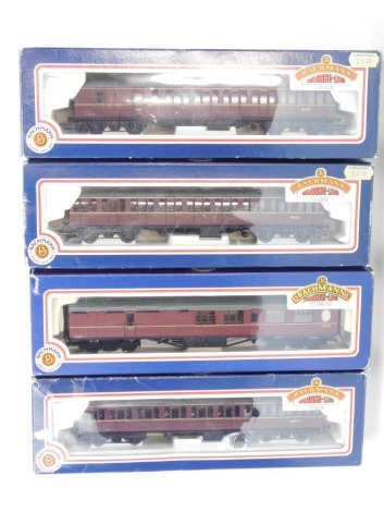 Bachmann Branchline OO gauge coaches, comprising 34-603 57ft BR MkI Suburban maroon, 34-451 63ft Thompson 2nd brake maroon BR, 34-602 57ft BR MkI Suburban maroon, and 34-626 57ft MkI Suburban brake maroon. (4)