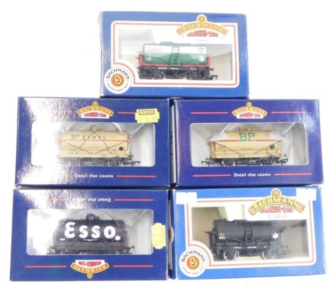 Bachmann Branchline OO gauge rolling stock, comprising 33-677 tank wagon with large filler Esso, 33-676 tank wagon with large filler BP/Ethanol, 37679 14 ton tank wagon BP, 33-502 14 ton tank wagon DCB tar black, and 33-505 14 ton tank wagon Castrol Oil. 