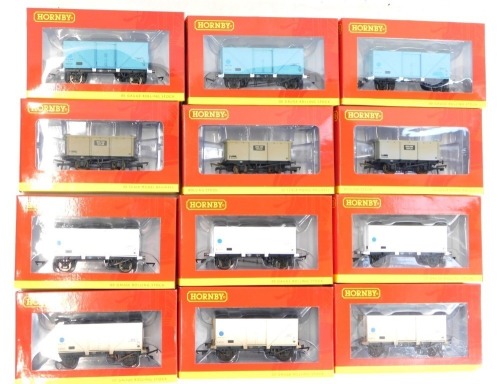 Hornby OO gauge rolling stock, comprising R6506 22 ton Iron Ore tipper weathered three pack, R6624A 12 ton fish van pack of three, R6624 12 ton fish van pack of three, R6759A BR Blue Spot 12 ton fish van, R675B BR blue 12 ton fish van, and R6759 BR Blue S