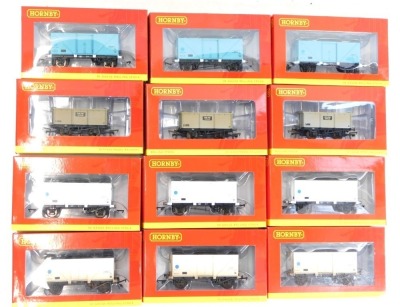 Hornby OO gauge rolling stock, comprising R6506 22 ton Iron Ore tipper weathered three pack, R6624A 12 ton fish van pack of three, R6624 12 ton fish van pack of three, R6759A BR Blue Spot 12 ton fish van, R675B BR blue 12 ton fish van, and R6759 BR Blue S