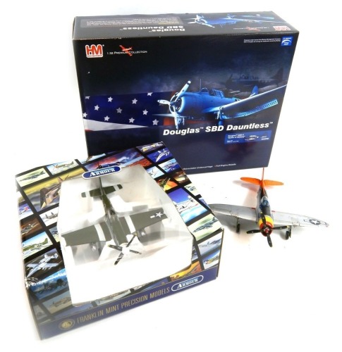 Three model aeroplanes, comprising a Franklin Mint 1:48 scale diecast model of a P-51 Mustang fighter, a Franklin Mint 1:48 scale Thunderbolt P-47 Fighter Tarheel Hal, and a 1:32 scale Hobby Master Douglas Dauntless SBD-2, boxed. (3)