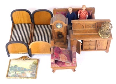 Large scale doll's house furniture, comprising two single beds, sofa and armchair, picture frame, sideboard and a long cased clock.