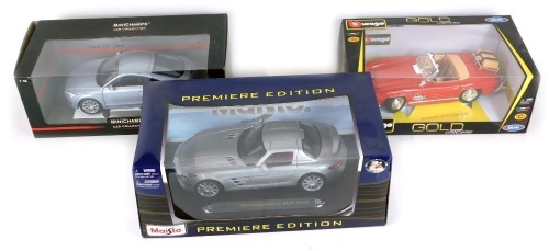 Three die cast vehicles, comprising a Maisto Mercedes Benz SLS AMG, Burago 1-18 scale Mercedes 300 SL Touring 1957, and a Mini Champs Car Collection Audi TT 2006, boxed. (3)