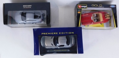 Three die cast vehicles, comprising a Maisto Mercedes Benz SLS AMG, Burago 1-18 scale Mercedes 300 SL Touring 1957, and a Mini Champs Car Collection Audi TT 2006, boxed. (3) - 2